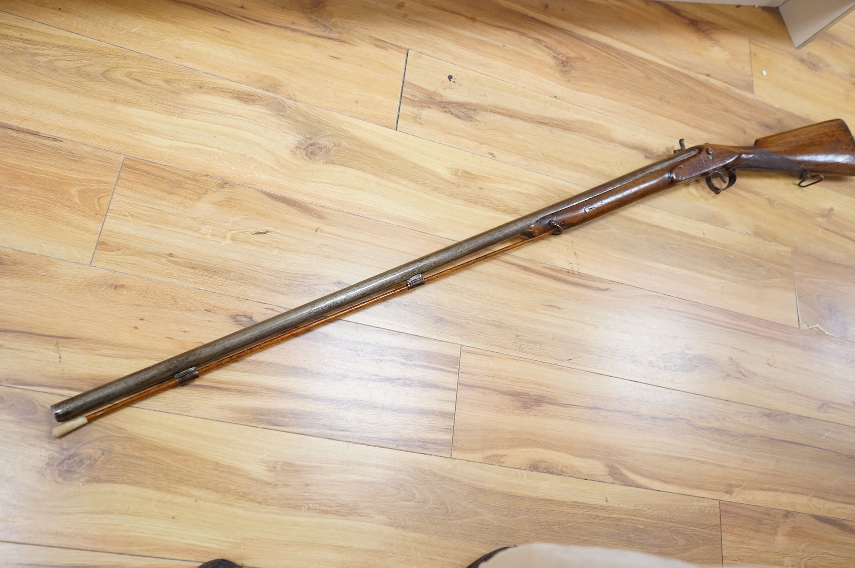 A Continental single barrel percussion sporting gun, barrel 106cm, half stocked with iron mounts and chequered grip